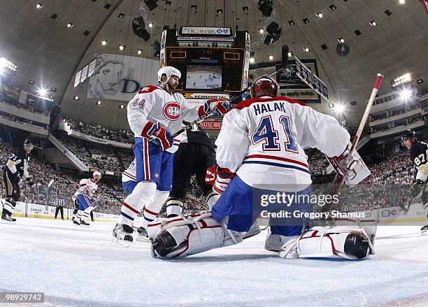 Jaroslav Halak of the Montreal Canadiens can't stop a shot by Kris Letang of the Pittsburgh Penguins in Game Five of the Eastern Conference...