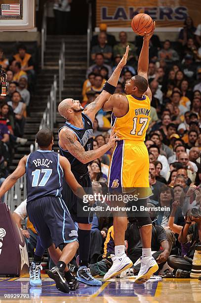 Andrew Bynum of the Los Angeles Lakers puts up a shot against Carlos Boozer of the Utah Jazz in Game Two of the Western Conference Semifinals during...