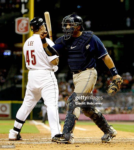 Catcher Yorvit Torrealba of the San Diego Padres pumps his fist as home plate umpire Bob Davidson calls Carlos Lee of the Houston Astros out on...