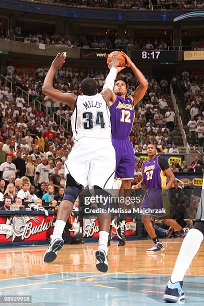 Shannon Brown of the Los Angeles Lakers shoots the ball over C.J. Miles of the Utah Jazz in Game Three of the Western Conference Semifinals during...