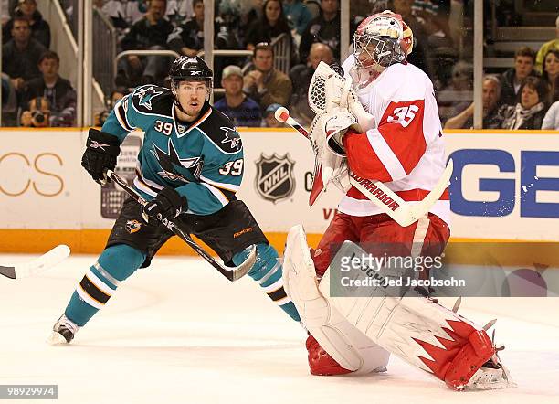 Logan Couture of the San Jose Sharks shoots against Jimmy Howard of the Detroit Red Wings in Game Five of the Western Conference Semifinals during...