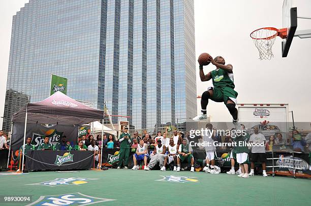 Participant dunks during the Sprite Slam Dunk Contest as part of the NBA Nation Mobile Basketball Tour on May 8, 2010 at the ÒCinco De Mayo Festival"...
