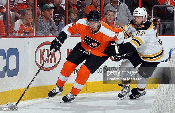 James van Riemsdyk of the Philadelphia Flyers skates against Mark Recchi of the Boston Bruins in Game Three of the Eastern Conference Semifinals...