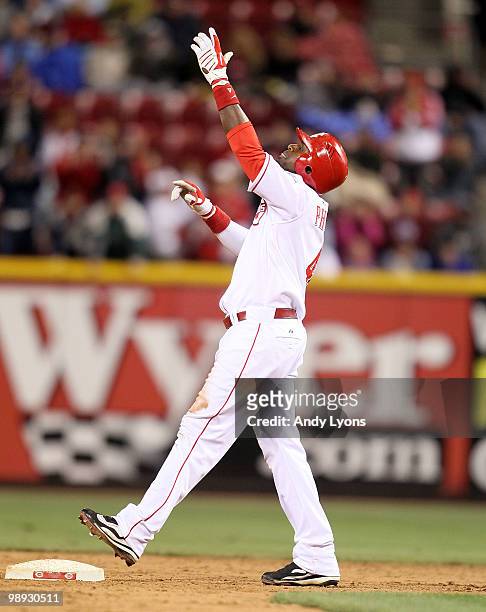 Brandon Phillips of the Cincinnati Reds celebrates after hitting a double during the game against the Chicago Cubs Great American Ball Park on May 8,...