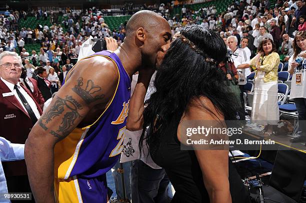 Kobe Bryant of the Los Angeles Lakers kisses his mom Pam Bryant after their win against the Utah Jazz in Game Three of the Western Conference...