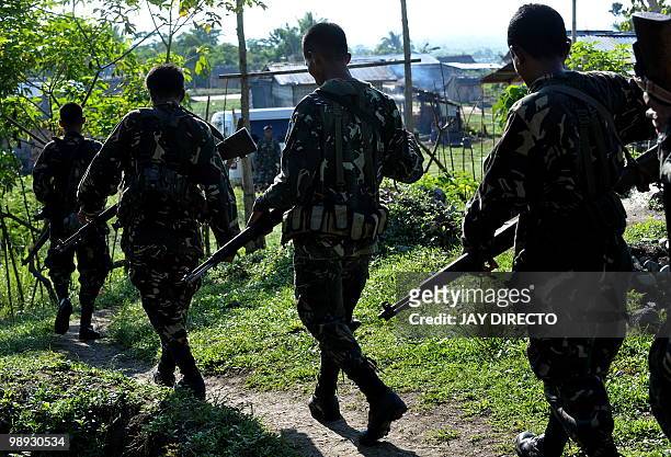 To go with focus story Philippines-politics-vote-violence by Jason Gutierrez Members of the Civilian Auxilliary Forces Geographical Unit, a militia...