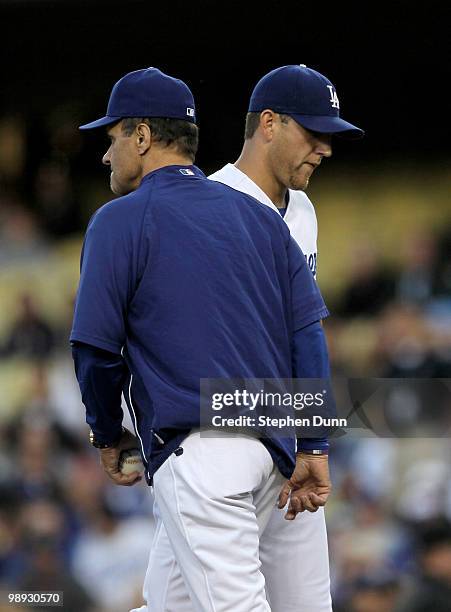 Manager Joe Torre of the Los Angeles Dodgers relieves starting pitcher Charlie Haeger in the first inning in game against the Colorado Rockies on May...