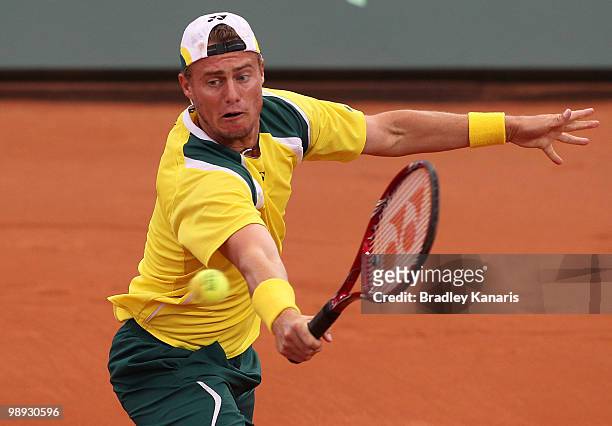 Lleyton Hewitt of Australia plays a backhand volley during his match against Yuichi Sugita of Japan during the match between Australia and Japan on...