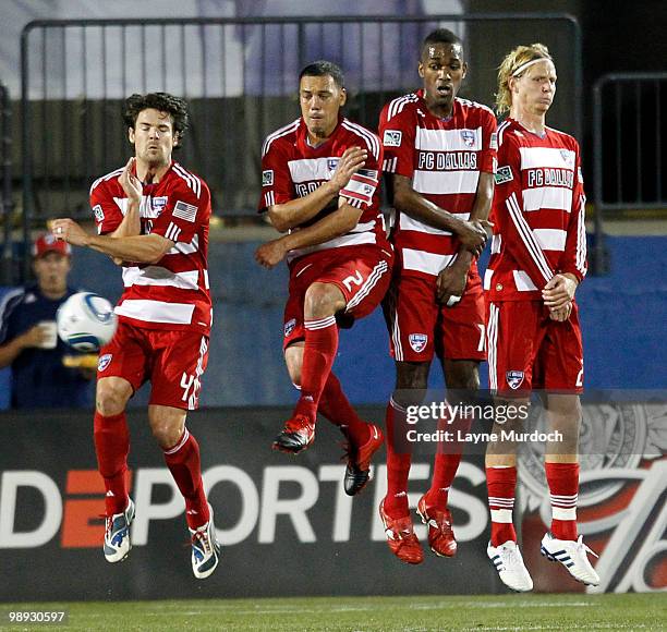 Heath Pearce, Daniel Hernandez, Atiba Harris and Brek Shea of FC Dallas form a wall and deflect the ball against D.C. United at Pizza Hut Park on May...