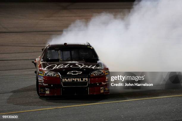 Smoke pours out the back of the Old Spice / Office Depot Chevrolet driven by Tony Stewart on track during the NASCAR Sprint Cup series SHOWTIME...