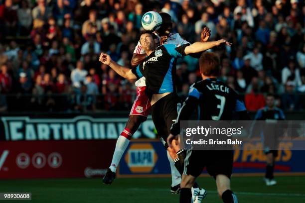 Defenseman Bobby Burling of the San Jose Earthquakes and Salou Ibrahim of the New York Red Bulls collide while heading the ball in the penalty box on...