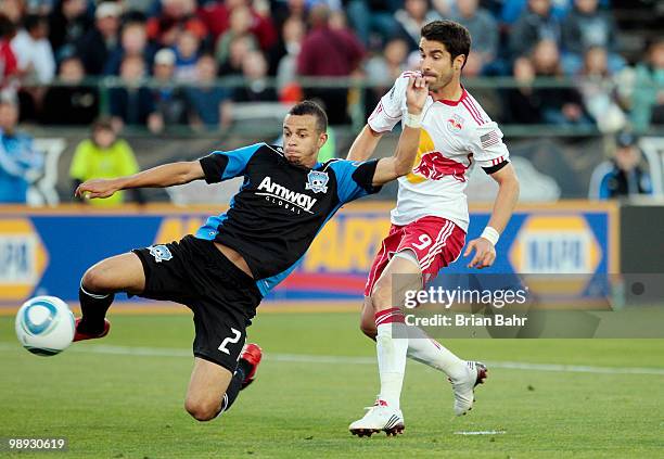 Defenseman Jason Hernandez of the San Jose Earthquakes clears the ball from in front of the goal out of the reach of forward Juan Pablo Angel of the...