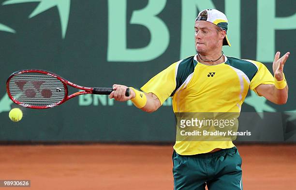 Lleyton Hewitt of Australia plays a forehand during his match against Yuichi Sugita of Japan during the match between Australia and Japan on day...