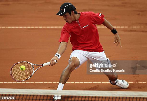 Yuichi Sugita of Japan plays a volley during his match against Lleyton Hewitt of Australia during the match between Australia and Japan on day three...