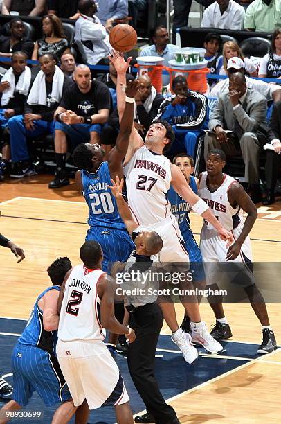 Zaza Pachulia of the Atlanta Hawks jumps against Mickael Pietrus of the Orlando Magic in Game Three of the Eastern Conference Semifinals during the...