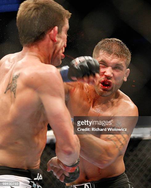 Jeremy Stephens punches Sam Stout in their lightweight "swing" bout at UFC 113 at Bell Centre on May 8, 2010 in Montreal, Quebec, Canada. Jeremy...