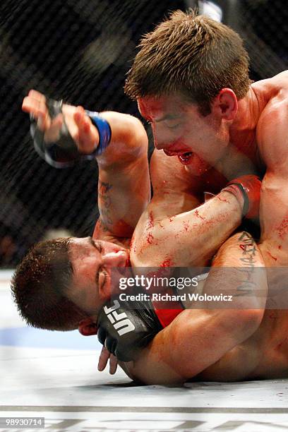 Sam Stout hits Jeremy Stephens with his elbow in their lightweight "swing" bout at UFC 113 at Bell Centre on May 8, 2010 in Montreal, Quebec, Canada....