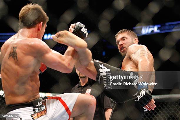 Jeremy Stephens kicks Sam Stout in their lightweight "swing" bout at UFC 113 at Bell Centre on May 8, 2010 in Montreal, Quebec, Canada.