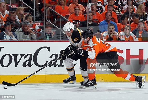 Blake Wheeler of the Boston Bruins skates against James van Riemsdyk of the Philadelphia Flyers in Game Three of the Eastern Conference Semifinals...