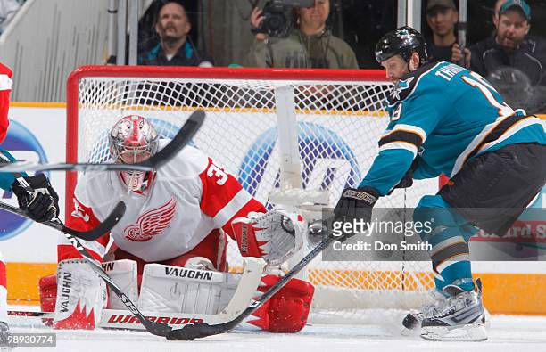 Joe Thornton of the San Jose Sharks scores a goal against Jimmy Howard of the Detroit Red Wings in Game Five of the Western Conference Semifinals...