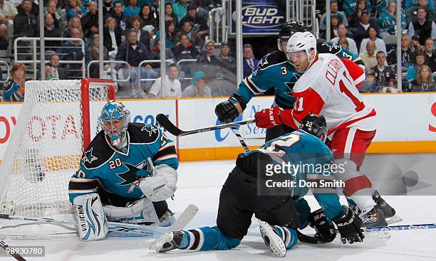 Dan Cleary of the Detroit Red Wings battles with Dan Boyle, Douglas Murray and Evgeni Nabokov of the San Jose Sharks in Game Five of the Western...