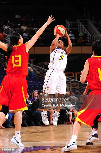 Temeka Johnson of the Phoenix Mercury shoots against Song Liwei of the China National Team in a WNBA game May 8, 2010 at U.S. Airways Center in...