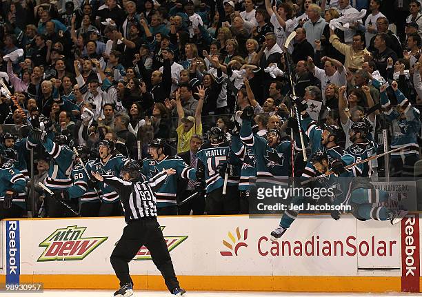 Members of the San Jose Sharks celebrate after defeating the Detroit Red Wings in Game Five of the Western Conference Semifinals during the 2010 NHL...