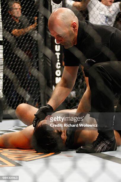 Lyoto Machida lies on the mat after been defeated by Mauricio "Shogun" Rua in their light heavyweight bout at UFC 113 at Bell Centre on May 8, 2010...