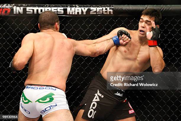 Mauricio "Shogun" Rua punches Lyoto Machida in their light heavyweight bout at UFC 113 at Bell Centre on May 8, 2010 in Montreal, Quebec, Canada.
