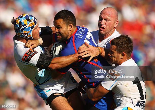 Evarn Tuimavave of the Knights is tackled during the round nine NRL match between the Newcastle Knights and the Gold Coast Titans at EnergyAustralia...