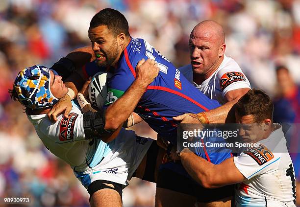 Evarn Tuimavave of the Knights is tackled during the round nine NRL match between the Newcastle Knights and the Gold Coast Titans at EnergyAustralia...