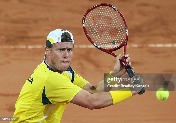 Lleyton Hewitt of Australia plays a backhand volley during his match against Yuichi Sugita of Japan during the match between Australia and Japan on...