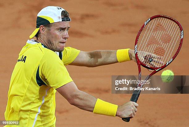 Lleyton Hewitt of Australia plays a backhand volley during his match against Yuichi Sugita of Japan during the match between Australia and Japan on...