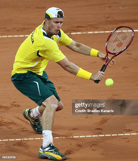 Lleyton Hewitt of Australia plays a backhand volley during his match against Yuichi Sugita of Japan during the match between Australia and Japan on...