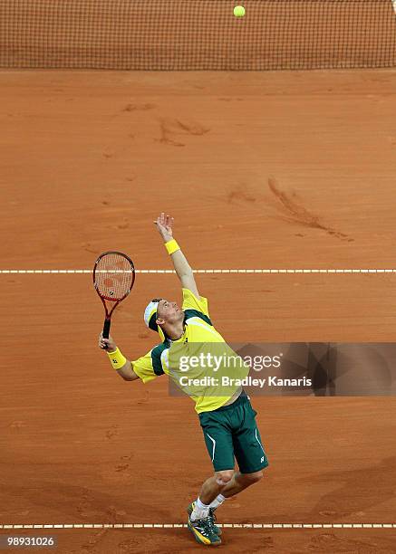 Lleyton Hewitt of Australia serves during his match against Yuichi Sugita of Japan during the match between Australia and Japan on day three of the...