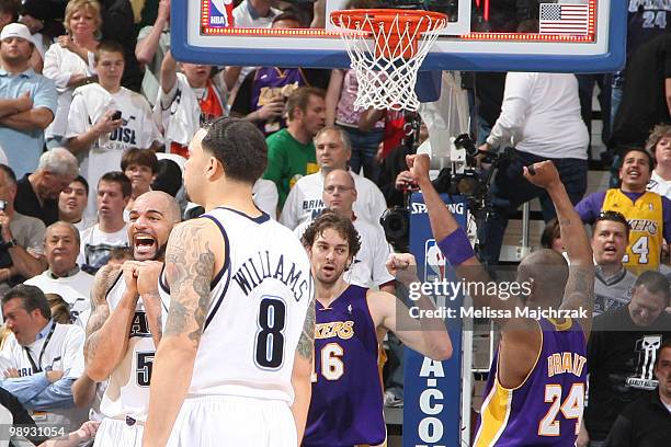 Carlos Boozer, Deron Williams of the Utah Jazz react to the game ending along with Kobe Bryant and Pau Gasol of the Los Angeles Lakers in Game Three...