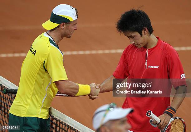 Lleyton Hewitt of Australia and Yuichi Sugita of Japan shake hands after the match between Australia and Japan on day three of the Davis Cup...