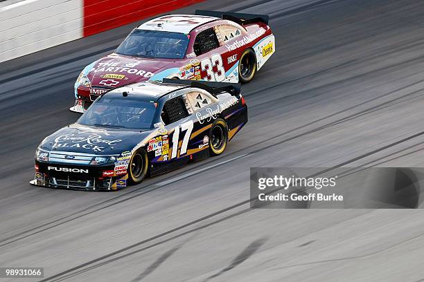 Matt Kensth, driver of the Crown Royal Black Ford, leads Clint Bowyer, driver of the The Hartford Chevrolet, during the NASCAR Sprint Cup series...