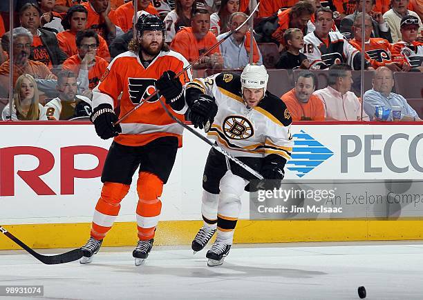 Scott Hartnell of the Philadelphia Flyers skates against Shawn Thornton of the Boston Bruins in Game Three of the Eastern Conference Semifinals...