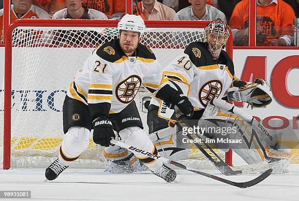 Tuukka Rask and Andrew Ference of the Boston Bruins defend the net against the Philadelphia Flyers in Game Three of the Eastern Conference Semifinals...