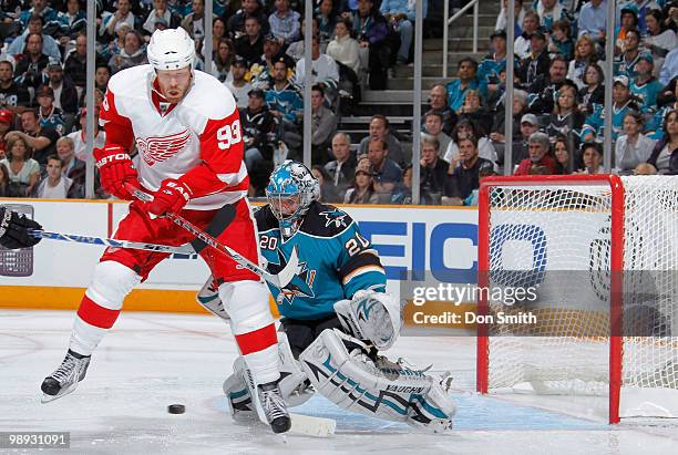 Johan Franzen of the Detroit Red Wings tries to tip a shot in front of Evgeni Nabokov of the San Jose Sharks in Game Five of the Western Conference...