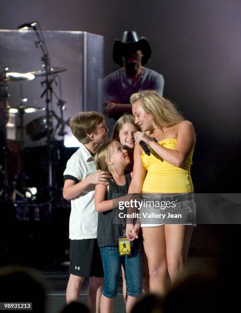 Country singer Tim McGraw and his children perform at Cruzan Amphitheatre on May 8, 2010 in West Palm Beach, Florida.