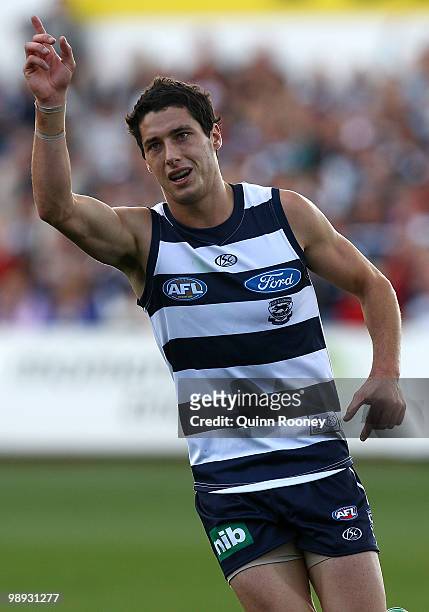 Simon Hogan of the Cats celebrates a goal during the round seven AFL match between the Geelong Cats and the Sydney Swans at Skilled Stadium on May 9,...
