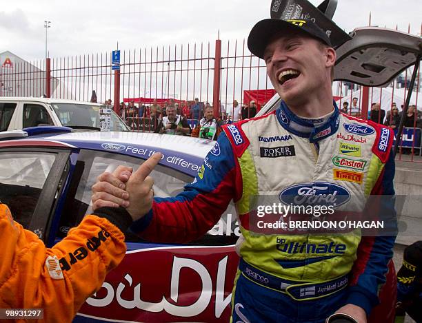 Finnish driver Jari-Matti Latvala driving for BP Ford Abu Dhabi world Rally team celebrates with other drivers after winnning the Rally of New...