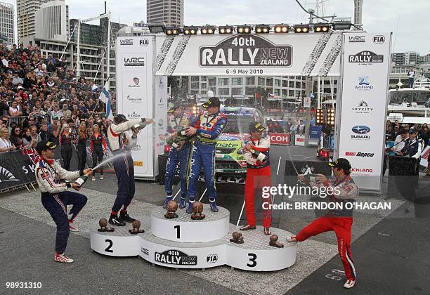 Second placed French drivers Sebastien Ogier and Julien Ingrassia, winners Miikka Anttila and Jari-Matti Latvala of Finland and third placed French...