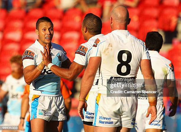 Scott Prince of the Titans celebrates with team mates after a Titans try during the round nine NRL match between the Newcastle Knights and the Gold...