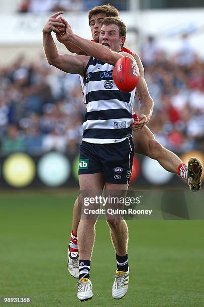 Nick Smith of the Swans spoils a mark by Steve Johnson of the Cats during the round seven AFL match between the Geelong Cats and the Sydney Swans at...