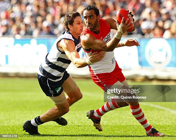 Adam Goodes of the Swans is tackled by Harry Taylor of the Cats during the round seven AFL match between the Geelong Cats and the Sydney Swans at...