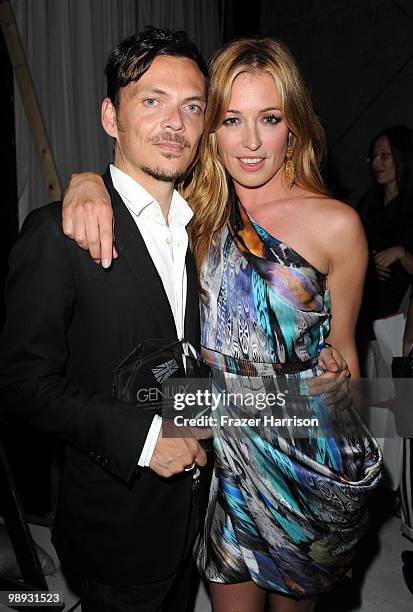 Designer Matthew Williamson poses with Cat Deeley, television host at the 2nd Annual Genlux Britweek Designer Of The Year Fashion Awards And Show at...