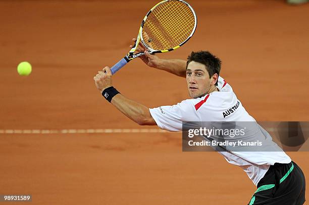 Carsten Ball of Australia plays a volley during his match against Tatsuma Ito of Japan during the match between Australia and Japan on day three of...